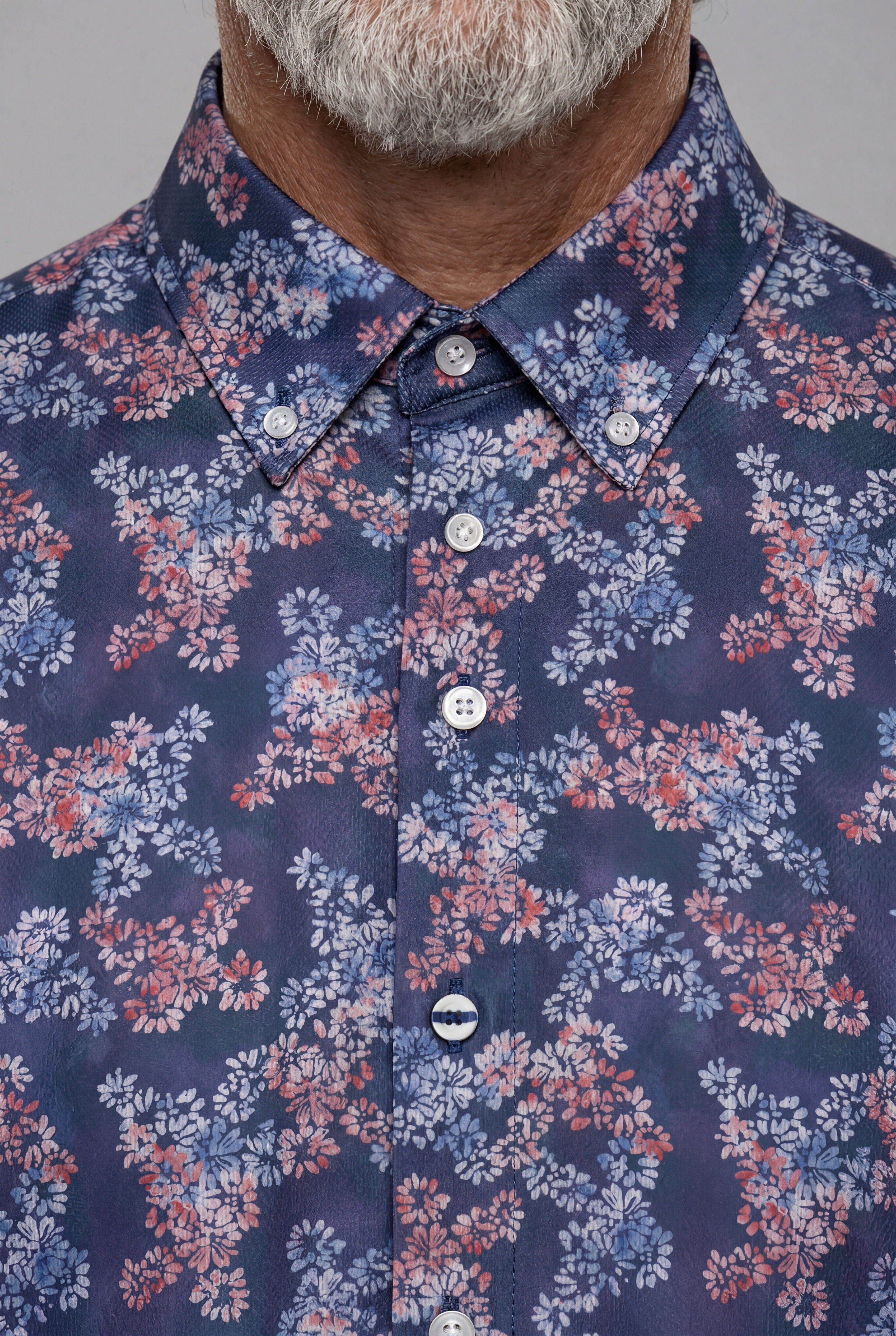 La chemise Claude Beau-fils - bouton signature
